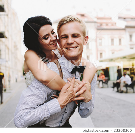 groom carries bride on his back groom carries bride on his back 23208300