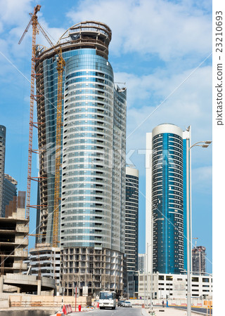 Abu Dhabi district with skyscrapers construction Abu Dhabi district with skyscrapers construction 23210693