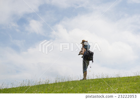 Father and daughter walking with a shoulder car Father and daughter walking with a shoulder car 23222053