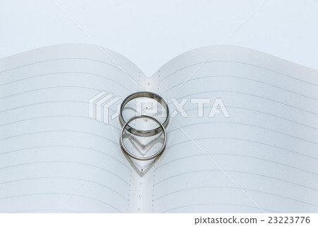 Heart shadow of Wedding Ring on center notebook 23223776