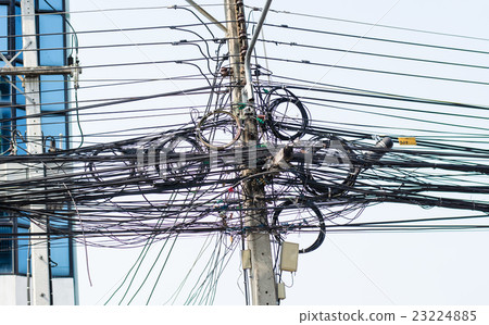 Electric pole with wires tangle 23224885