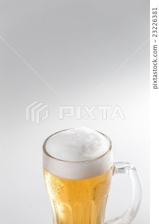 Beer poured into mugs · white back Beer poured into mugs · white back 23226381