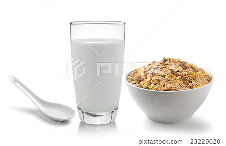 milk in the glass and muesli breakfast placed  23229020