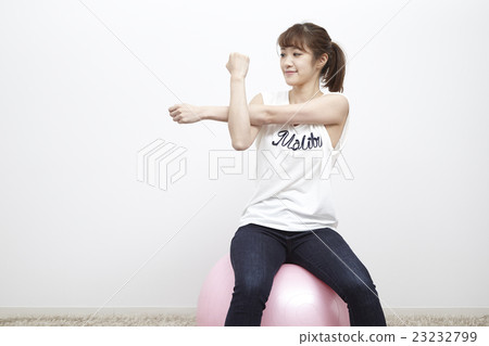 Young woman balancing pole, stretch Young woman balancing pole, stretch 23232799