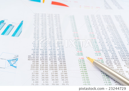 Financial charts with pen . 23244729