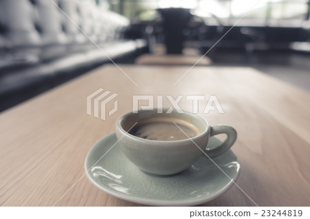 Espresso Coffee cup on wood table . ( Filtered image processed vintage effect. ) 23244819