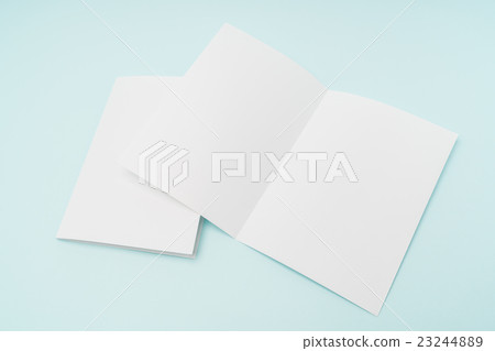 Bifold white template paper on blue background . 23244889