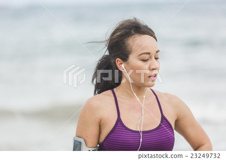 Portrait of young sports woman standing on the Portrait of young sports woman standing on the 23249732