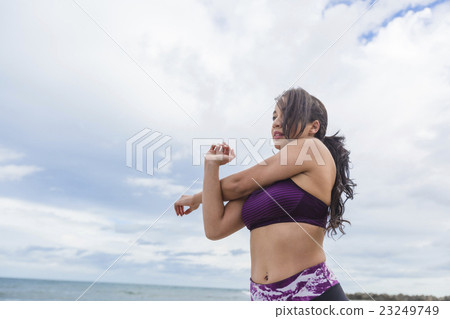 Young fit female stretching and heating up before Young fit female stretching and heating up before 23249749