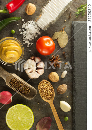 herbs and spices at table herbs and spices at table 23250240
