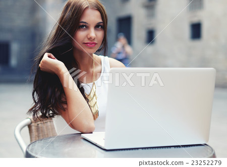 Female university student working on computer  23252279