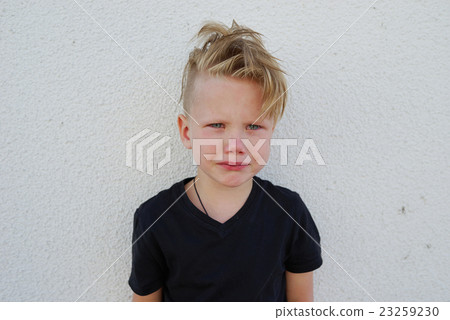 young emotional boy on bright background 23259230