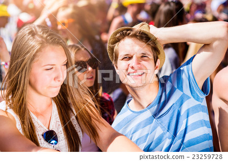 Teenagers at summer music festival enjoying Teenagers at summer music festival enjoying 23259728