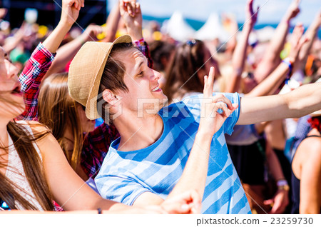 Teenagers at summer music festival enjoying Teenagers at summer music festival enjoying 23259730