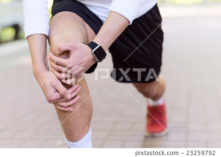 Professional male runner warming up 23259792