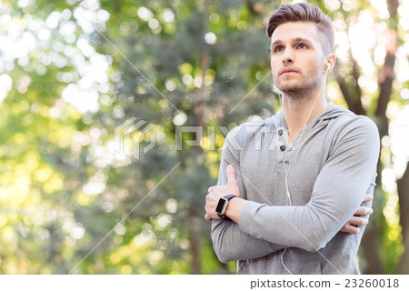 Thoughtful male runner making break Thoughtful male runner making break 23260018