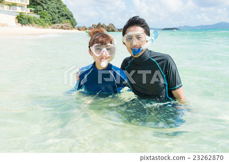 A couple taking snorkeling A couple taking snorkeling 23262870