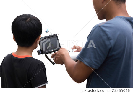 Father and son control remote drone helicopter  23265046