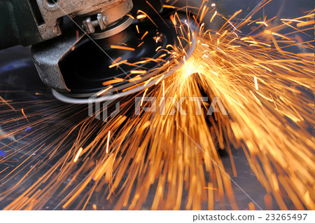 Worker cutting metal with grinder 23265497