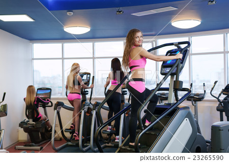 Image of workout in gym. Cute girl poses at camera 23265590