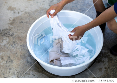 Woman hands wash stain of dirty clothes 23265809