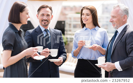 Cheerful smiling colleagues drinking coffee 23267952
