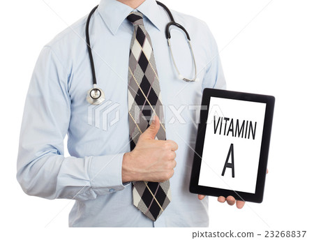 Doctor holding tablet - Vitamin A 23268837