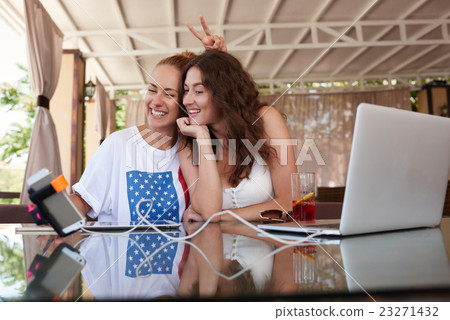 Ladies making photo with cell telephone  23271432