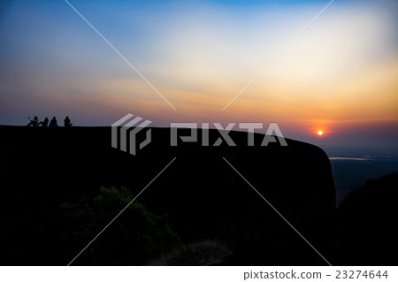 silhouette group of people on the top of the rock 23274644