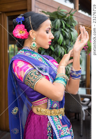 Beautiful young indian woman traditional clothing Beautiful young indian woman traditional clothing 23276719