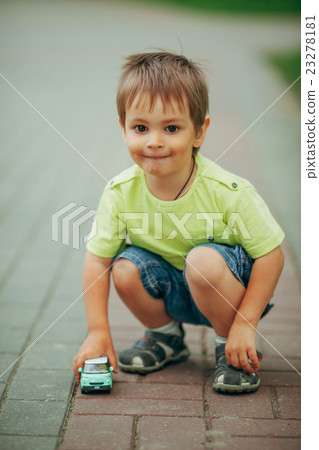 little boy playing with toy car little boy playing with toy car 23278181