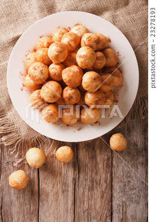 loukoumades donuts with honey and cinnamon closeup loukoumades donuts with honey and cinnamon closeup 23278193