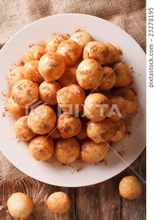 Greek loukoumades donuts with honey and cinnamon Greek loukoumades donuts with honey and cinnamon 23278195