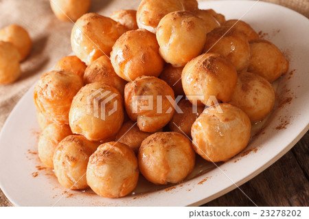 loukoumades donuts with honey and cinnamon 23278202