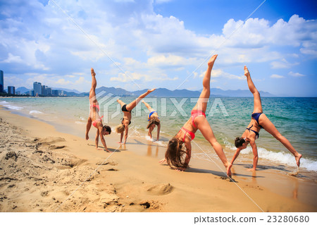 cheerleaders perform hand scale and Heel Stretch cheerleaders perform hand scale and Heel Stretch 23280680