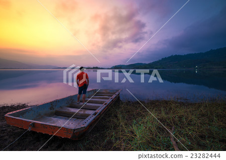 Lake with boat in morning 23282444