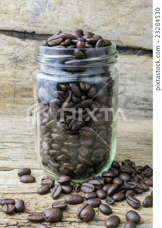 coffee bean in bottle on the wood 23284530