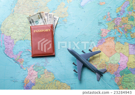 Toy plane on map. 23284943