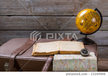 Globe next to opened book. Globe next to opened book. 23284948