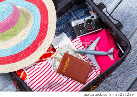 Camera in suitcase with clothes. Camera in suitcase with clothes. 23285289