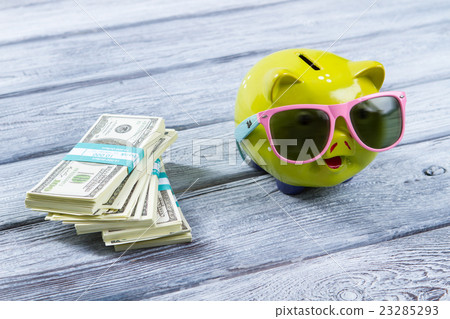 Dollar bundles and money box. Dollar bundles and money box. 23285293