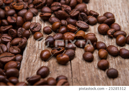 Coffee beans on wooden background. Coffee beans on wooden background. 23285312