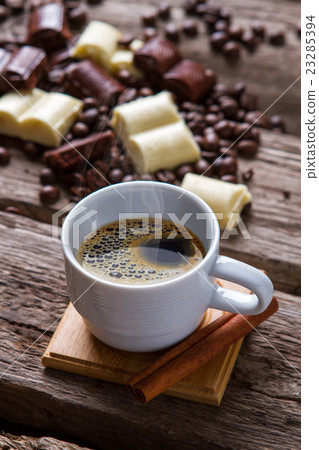 White cup with coffee. White cup with coffee. 23285394