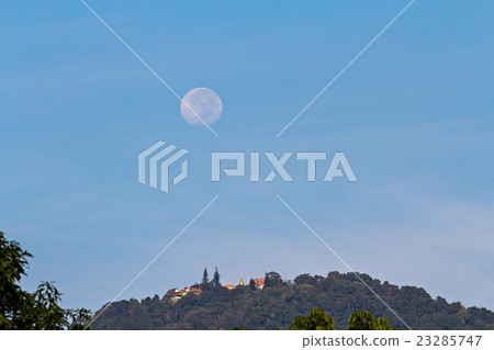 Full moon setting over Buddhist temple on mountain Full moon setting over Buddhist temple on mountain 23285747
