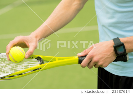 Professional athlete playing tennis in stadium Professional athlete playing tennis in stadium 23287614