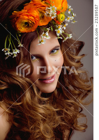 Beauty young woman with flowers and make up close Beauty young woman with flowers and make up close 23289587