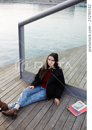 Young woman student is resting in the fresh air Young woman student is resting in the fresh air 23290582