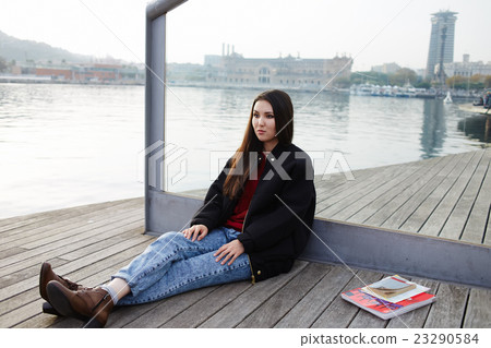 Pretty woman is resting near sea Pretty woman is resting near sea 23290584