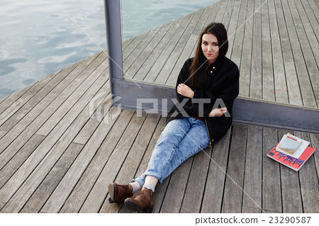Young female is resting outside Young female is resting outside 23290587