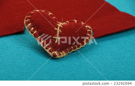 Felt craft and art brown heart cut out on blue Felt craft and art brown heart cut out on blue 23292094